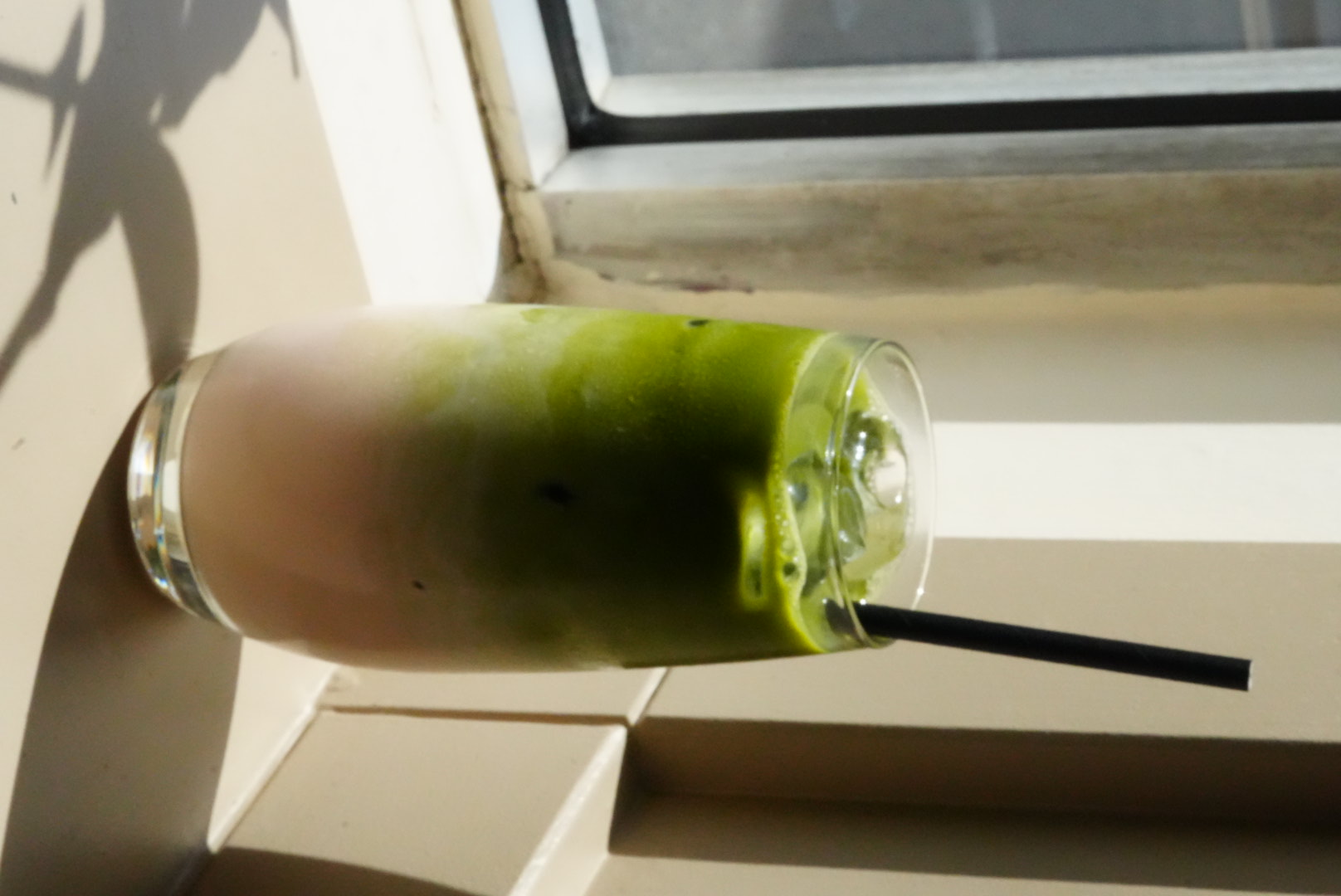 Iced matcha latte in a tall glass