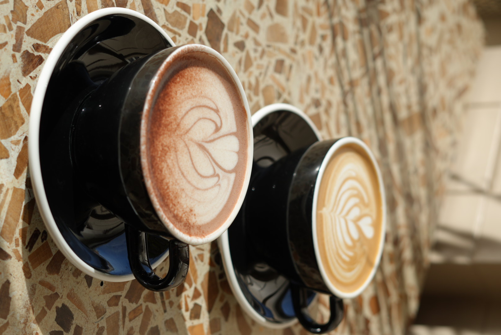 Flat white and hot chocolate side by side