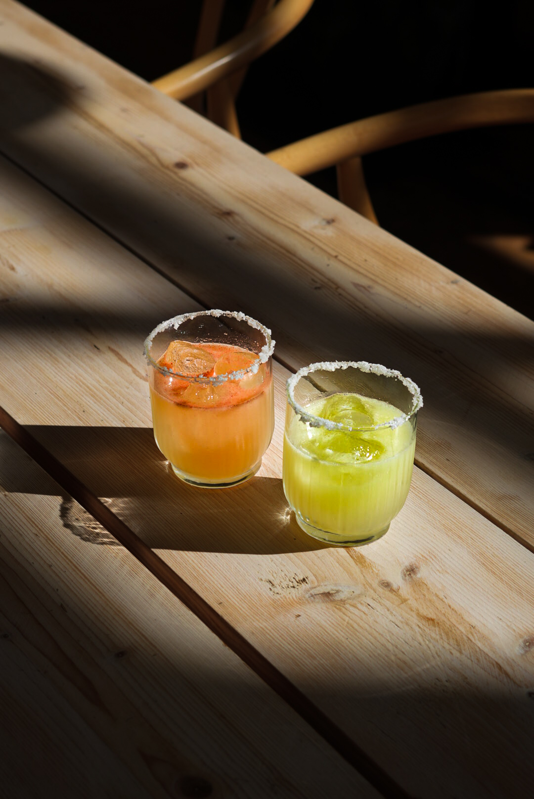 Spicy and classic margarita on a sunlit table