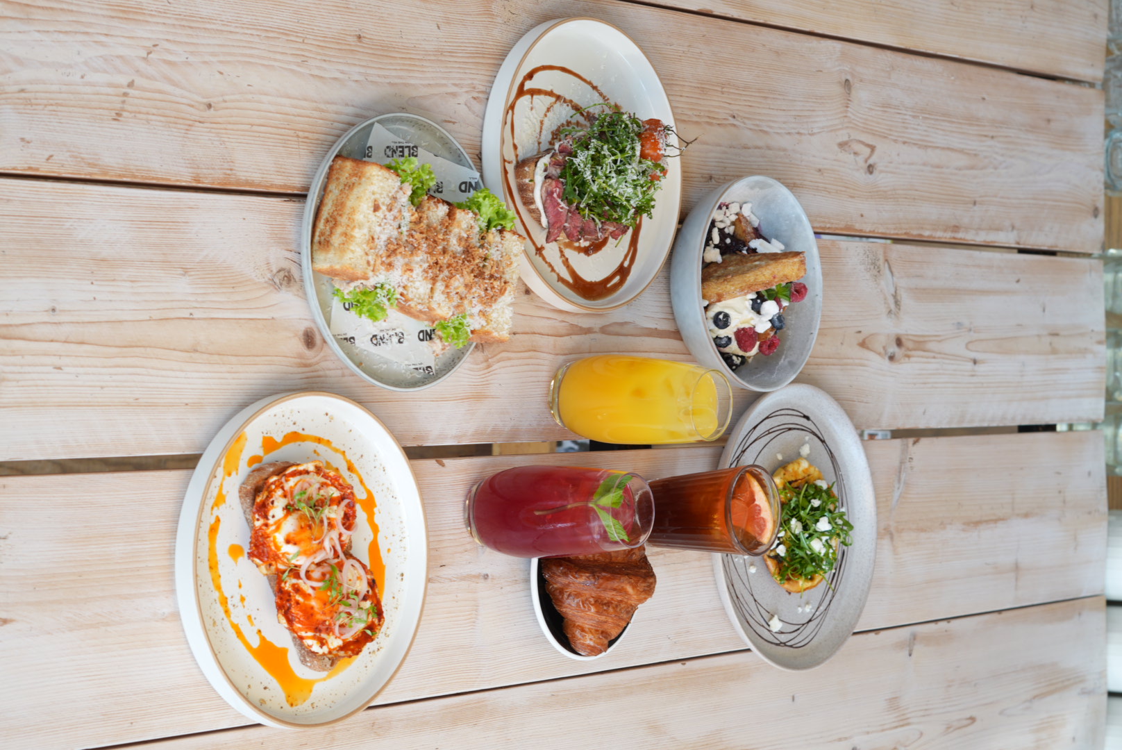 Overhead brunch spread with drinks