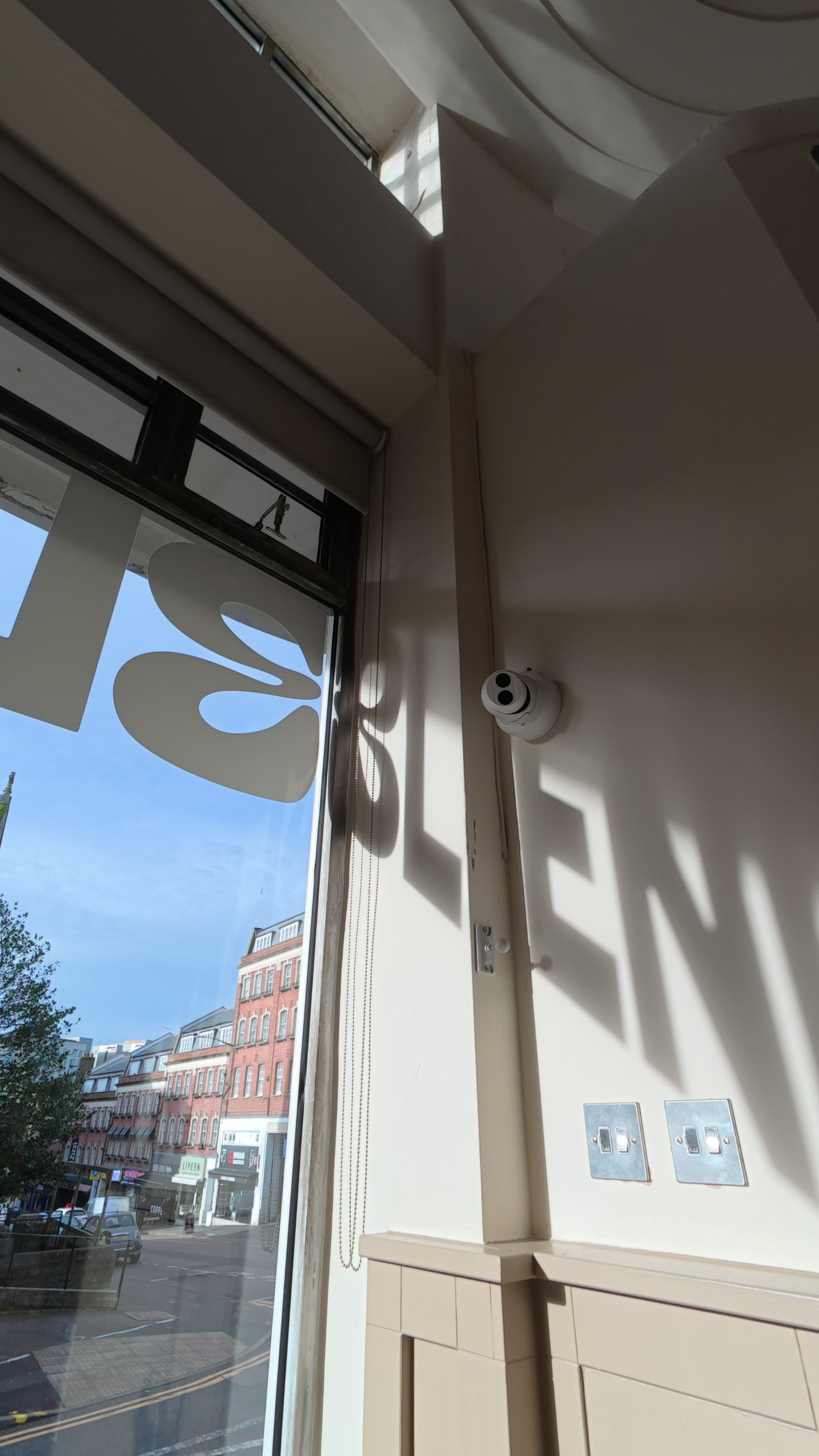 Sunlight casting the Blend window decal onto the wall